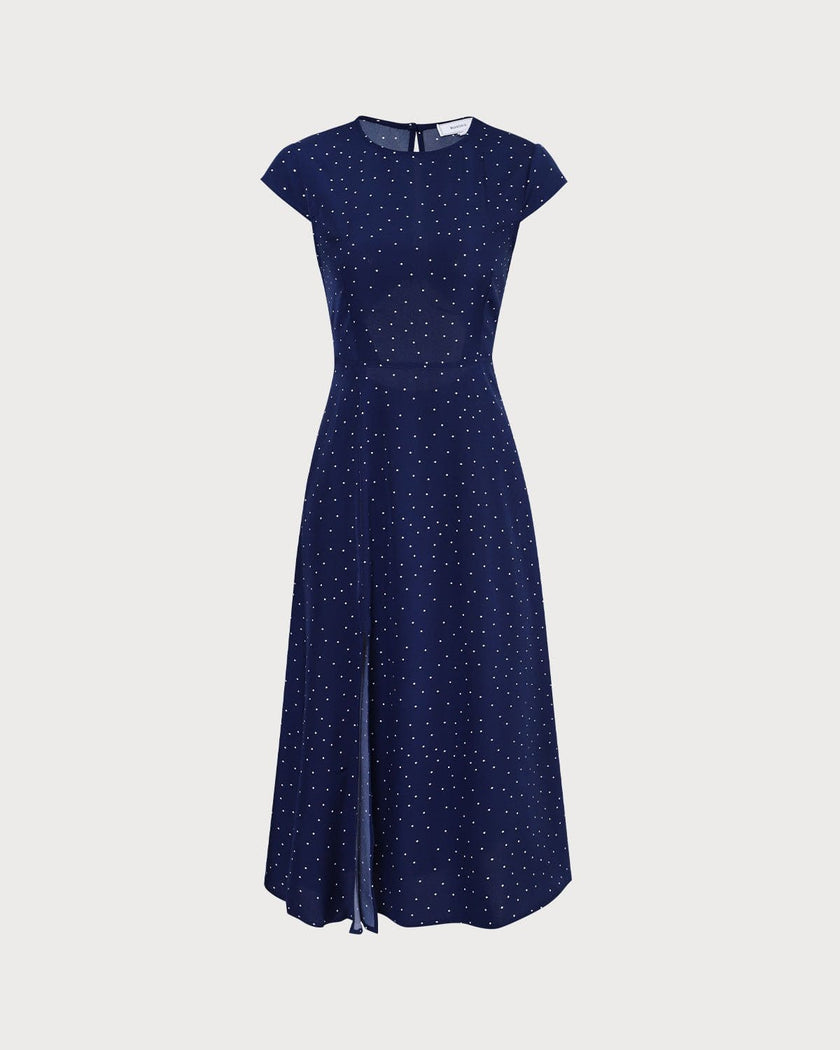 FJØRNA polka dot midi dress for women with round neck and cutout design, showcasing a stylish and feminine dress silhouette.