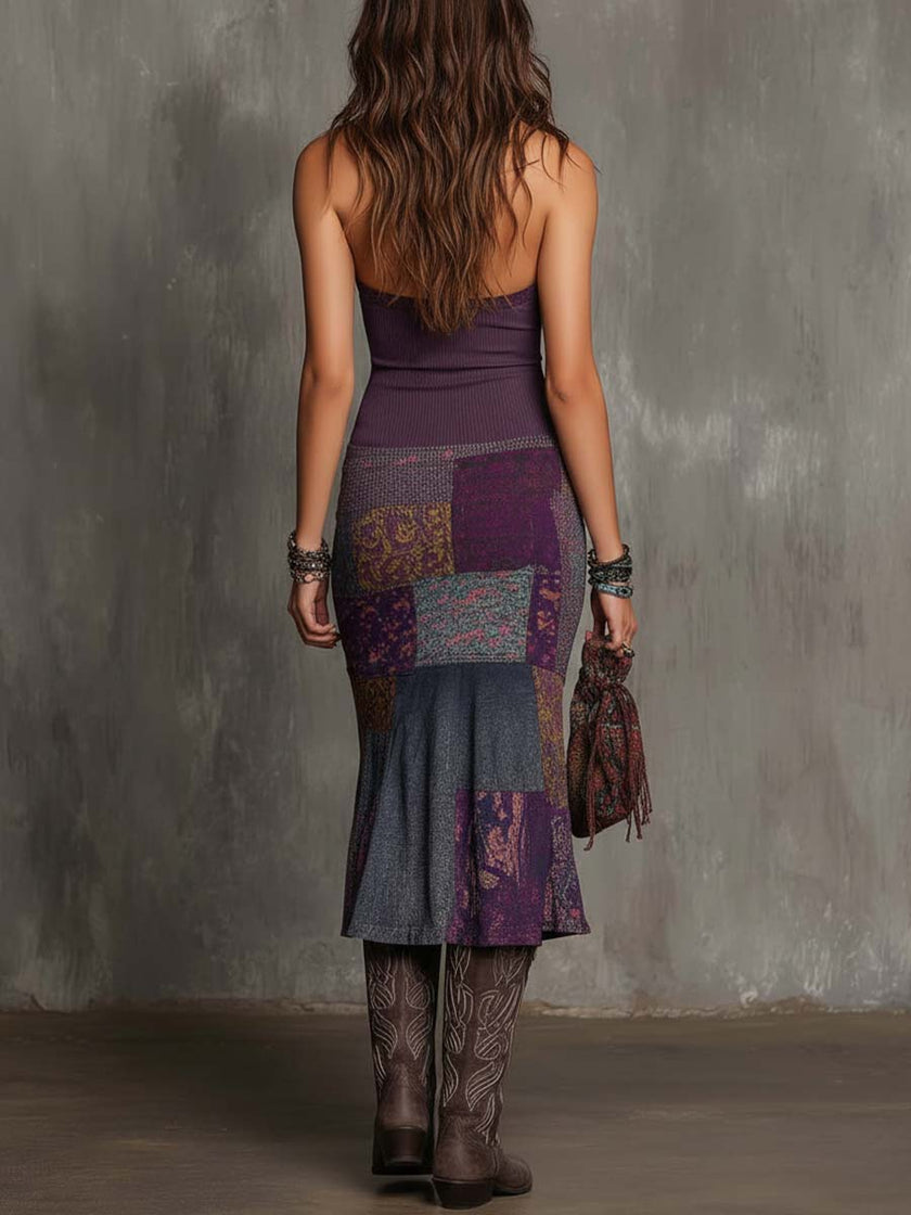 FJØRNA knit halter neck midi dress for women, showcasing a stylish sleeveless design with a fitted waist and midi length.