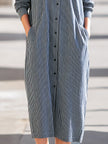 FJØRNA midi dress for women featuring a flowy, stylish design with a fitted waist and elegant neckline.