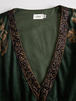 Green faux suede tassel maxi dress for women by FJØRNA, featuring a flowing silhouette and stylish tassel details.