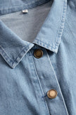Light blue denim flared long sleeve wide-leg jumpsuit for women by FJØRNA, featuring a stylish and comfortable fit.