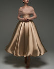 Pink satin midi dress by FJØRNA featuring a strapless, A-line silhouette with a shawl and strappy details for women.