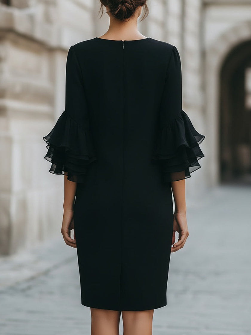 Black ruffled sheer sleeve midi dress by FJØRNA, elegant cocktail dress with flowy ruffled details and sheer long sleeves.