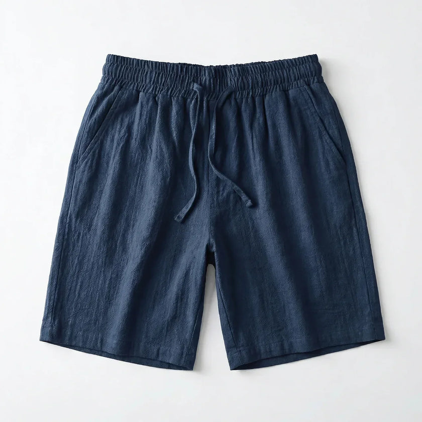 Men's summer linen shorts by FJØRNA, light and breathable fabric, shown in a relaxed fit with casual style.