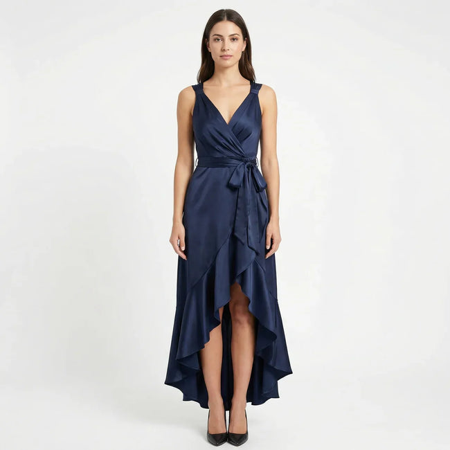 Women's elegant sleeveless wrap midi dress by FJØRNA, showcasing a stylish design with a fitted waist and flowing fabric.