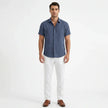 Men's FJØRNA cotton-linen short sleeve shirt, lightweight and breathable, shown in a natural fabric weave with a classic collar and button front.