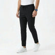 Men's stretchable comfort trousers by FJØRNA, showing a close-up of the black stylish men's pants with a relaxed fit and stretch fabric.