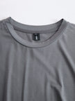 Grey FJØRNA ruched maxi dress for women, elegant full-length dress with gathered fabric and flowing silhouette.