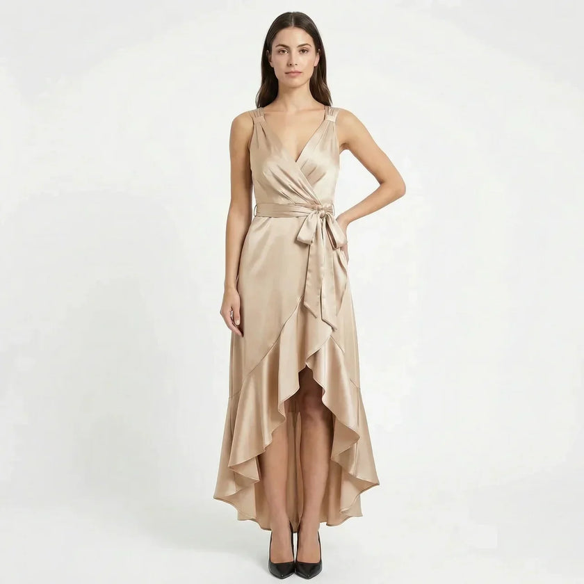 FJØRNA women's elegant sleeveless wrap midi dress hanging on a wooden hanger with a neutral background.