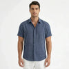 Men's FJØRNA cotton-linen short sleeve shirt displayed on a hanger, featuring a lightweight, breathable fabric and classic collar.