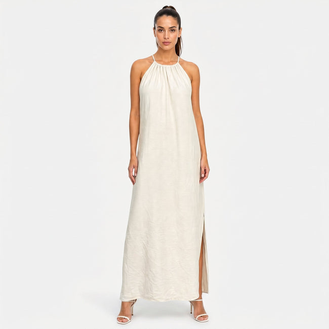 FJØRNA women's sleeveless halter neck summer maxi dress with flowing fabric and vibrant pattern, perfect for warm weather.