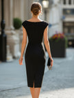 FJØRNA asymmetric draped cap-sleeve midi cocktail dress displayed on a hanger, showcasing elegant fabric and unique design details.