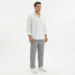 Men's wide-leg summer pants by FJØRNA, lightweight and relaxed fit, shown in a neutral color on a model.