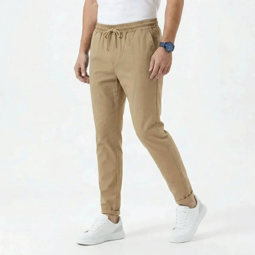 Men's stretchable comfort trousers by FJØRNA, shown in a relaxed fit with a versatile waistband and casual style.