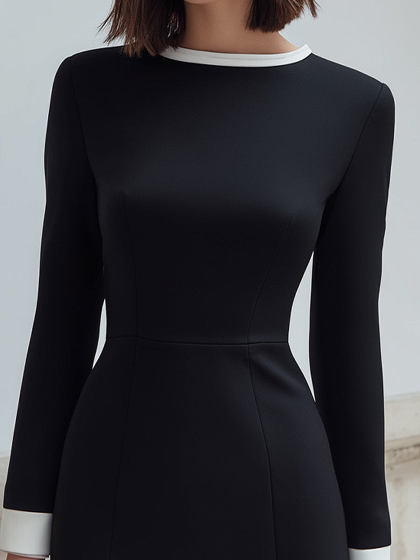 FJØRNA black long-sleeve mini dress with contrast trim, perfect for cocktail events, featuring a stylish and fitted design.