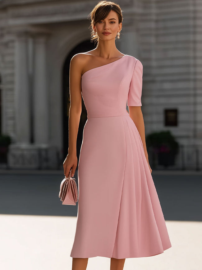 FJØRNA blush pink one-shoulder pleated midi dress displayed on a hanger, showcasing its elegant design and flowy fabric.