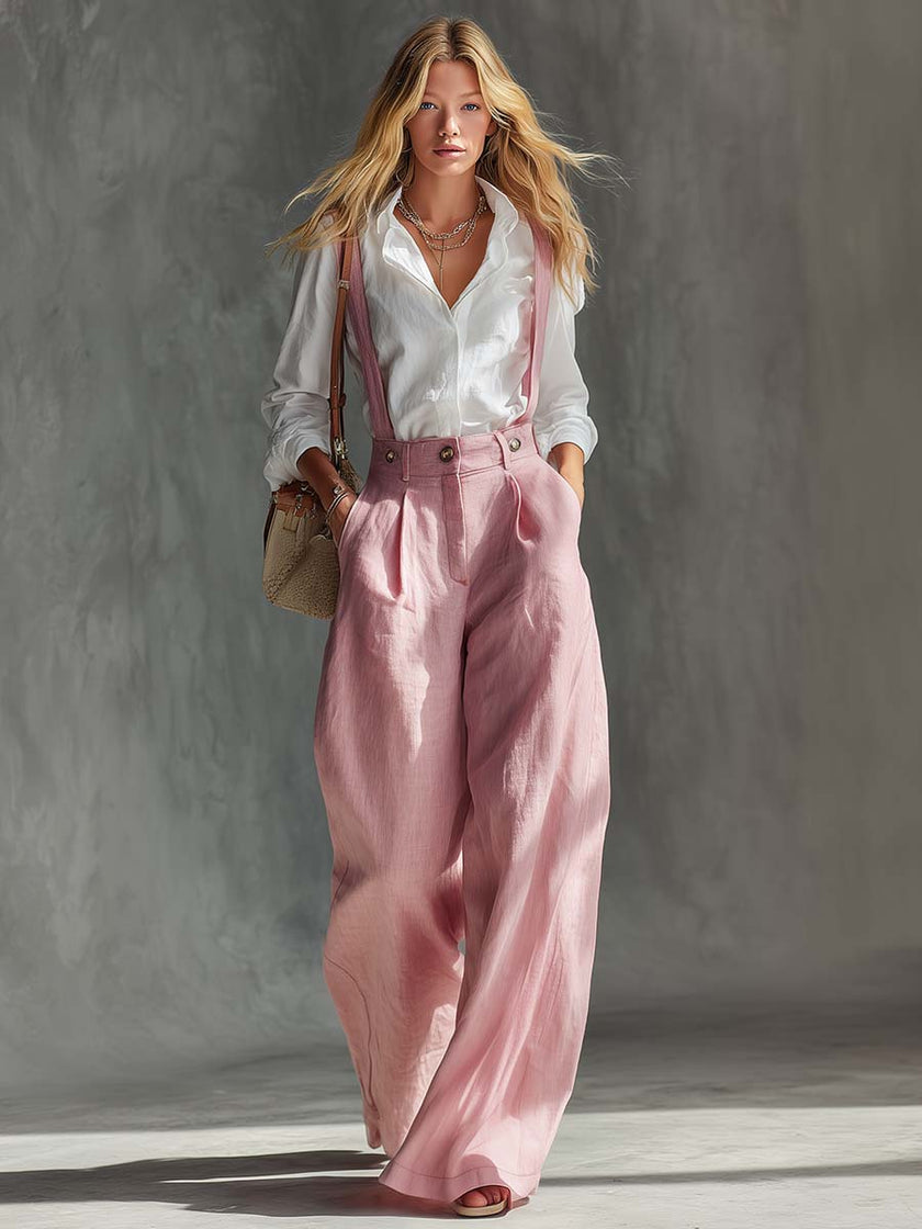 Pink cotton linen wide-leg women's dungarees by FJØRNA, styled as casual pants with adjustable straps and relaxed fit.