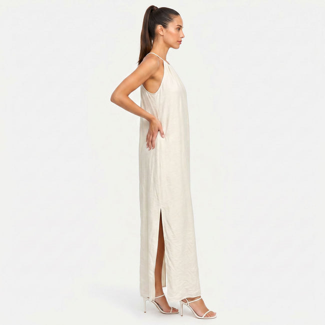 FJØRNA women's sleeveless halter neck summer maxi dress in lightweight fabric, flowing design, and vibrant color.