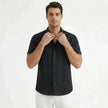 Men's cotton-linen short sleeve shirt by FJØRNA, lightweight and breathable with a casual button-up style, shown in the image.