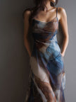 FJØRNA chiffon maxi dress for women featuring a retro style with flowing fabric and elegant design.