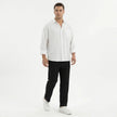 Men's wide leg summer pants from FJØRNA, featuring lightweight fabric and relaxed fit, displayed on a hanger.