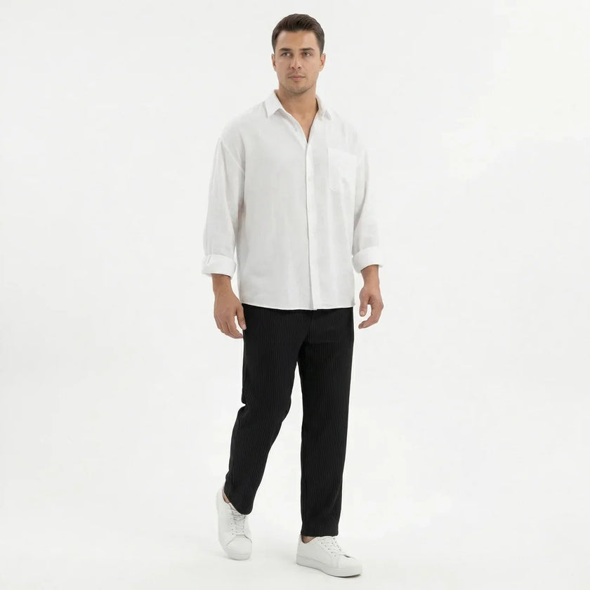 Men's wide leg summer pants from FJØRNA, featuring lightweight fabric and relaxed fit, displayed on a hanger.