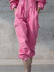 Pink denim strappy tapered long sleeve jumpsuit for women by FJØRNA, featuring stylish design and fitted silhouette.