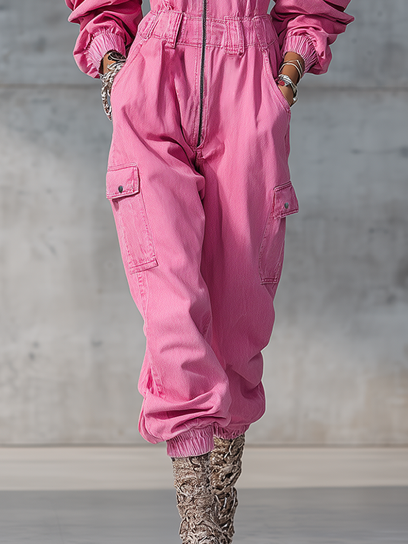 Pink denim strappy tapered long sleeve jumpsuit for women by FJØRNA, featuring stylish design and fitted silhouette.