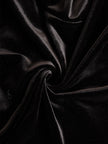 Elegant black velvet and satin midi dress for women by FJØRNA, featuring a sophisticated design and flowing silhouette.