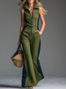 FJØRNA green sleeveless jumpsuit with stand collar and front zip, featuring slim pants for women, stylish and modern design.