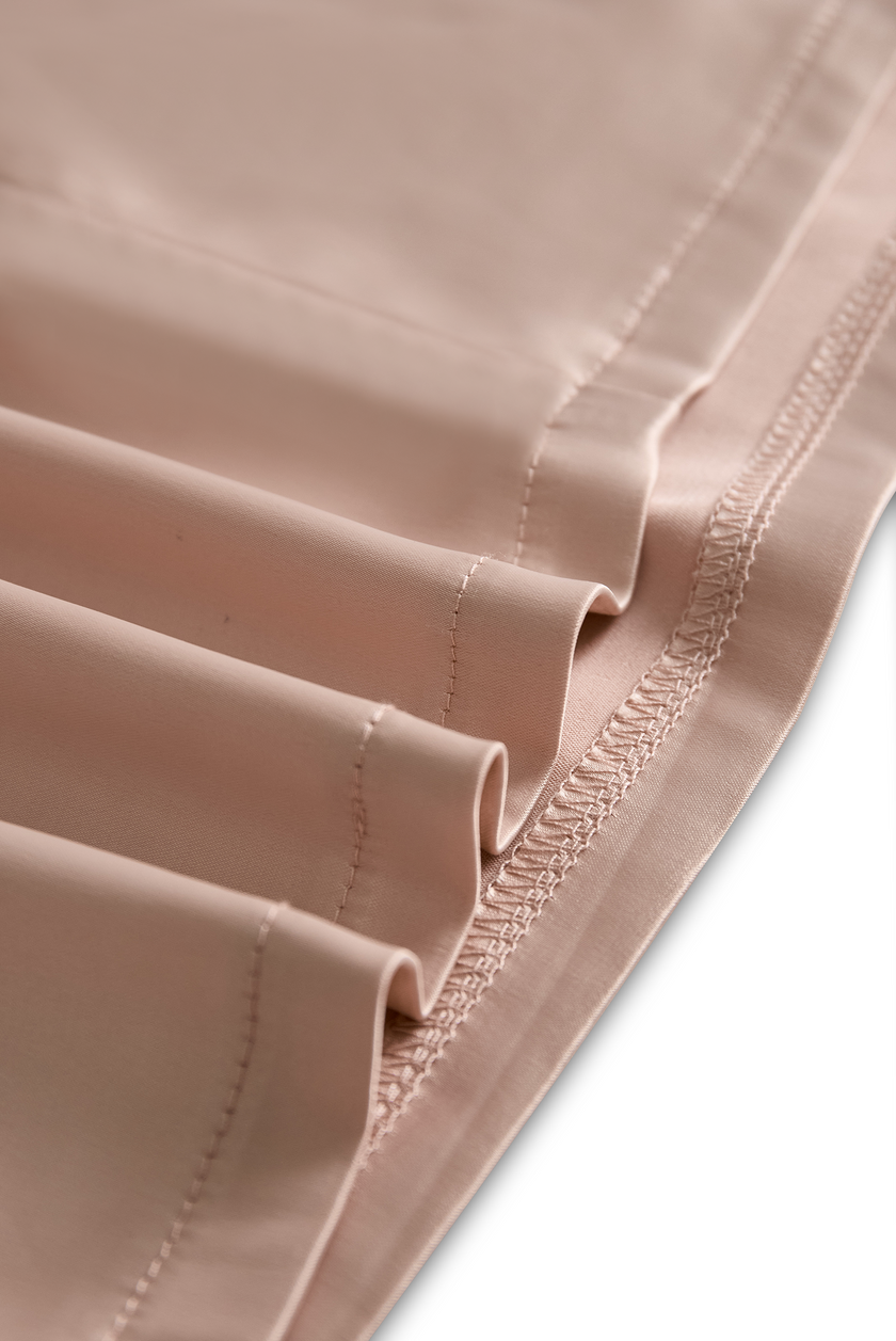 FJØRNA champagne satin square-neck long-sleeve mini dress, elegant cocktail dress with a fitted silhouette and satin finish.
