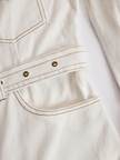 FJØRNA denim tassel mini dress for women featuring a casual sleeveless design with tassel accents and a fitted silhouette.