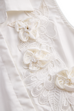 White sleeveless floral embroidery blouse for women by FJØRNA, featuring delicate embroidery and a stylish sleeveless design.