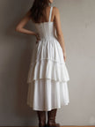 FJØRNA retro boho corset tiered midi dress with lace trim, featuring a flowy silhouette and vintage-inspired design.