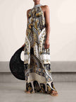 FJØRNA women's maxi dress with vibrant retro pattern print, perfect for summer, stylish and flowing for warm weather wear.