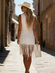 White denim tassel mini dress by FJØRNA, casual dress with tassel details and sleeveless design, perfect for summer wear.