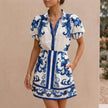 Blue linen floral two-piece women's co-ord set by FJØRNA, featuring a stylish top and matching skirt for a sophisticated look.