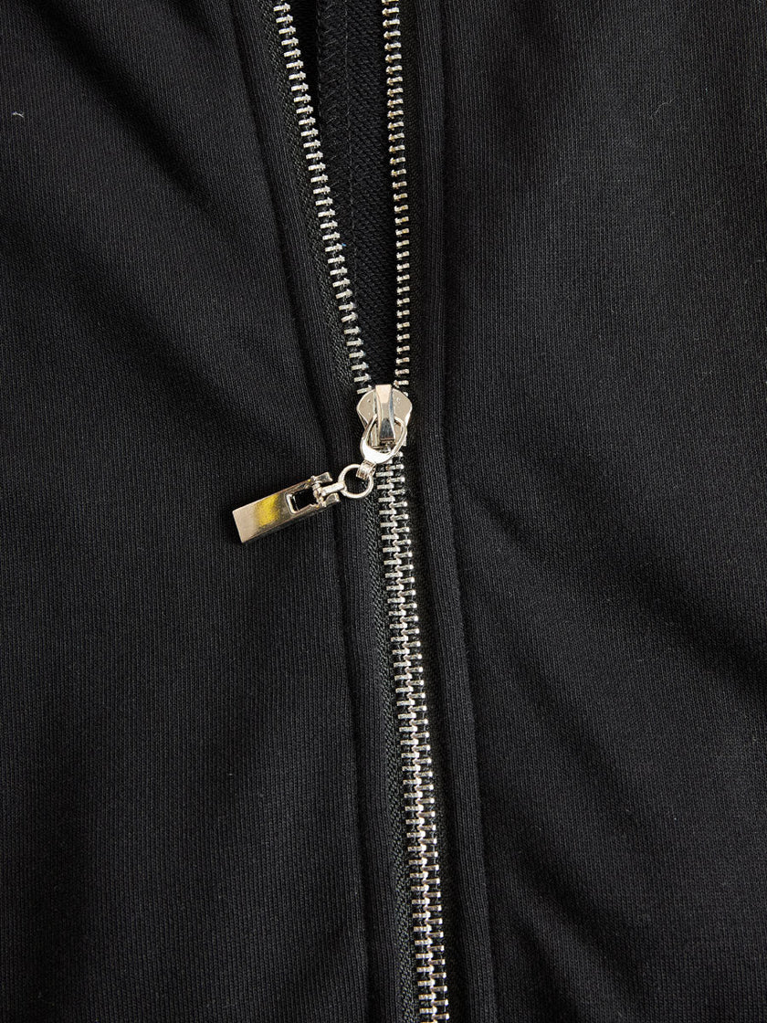 FJØRNA black sleeveless hooded jumpsuit with vertical stripes, featuring a relaxed fit and stylish design for women's pants.