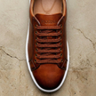 Pair of men's genuine leather shoes from FJØRNA, showcasing classic smart leather design and polished finish.