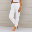 FJØRNA women's lightweight summer trousers with elastic waist and breathable fabric, shown in a relaxed fit style.