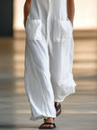 White linen sleeveless wide-leg women's jumpsuit by FJØRNA, featuring a relaxed fit and stylish design.