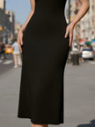 Black halter midi dress with white Peter Pan collar by FJØRNA, featuring a stylish cocktail dress design and elegant fit.