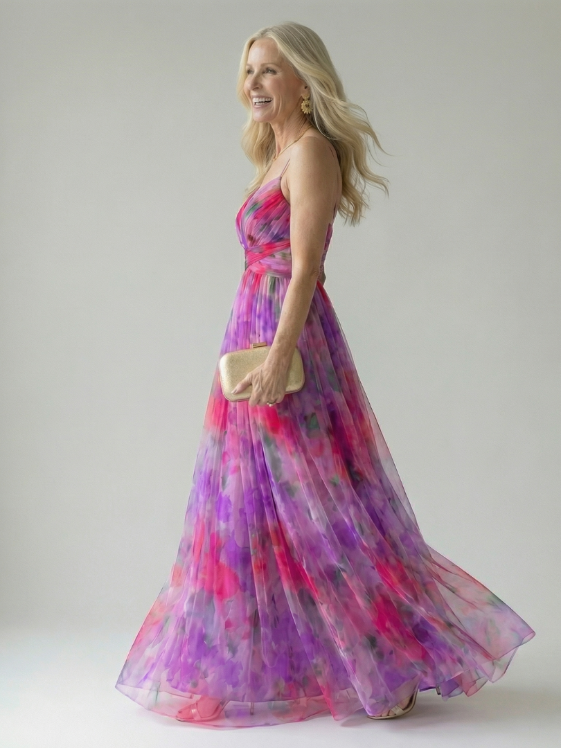 FJØRNA women's sleeveless summer maxi dress with a flowy design, lightweight fabric, and vibrant floral pattern.