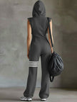 FJØRNA black sleeveless hooded jumpsuit with vertical stripes, designed as women's pants, featuring a relaxed fit and casual style.