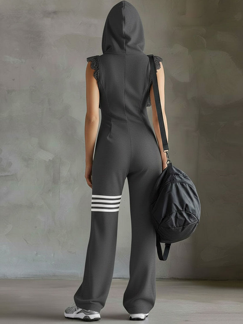 FJØRNA black sleeveless hooded jumpsuit with vertical stripes, designed as women's pants, featuring a relaxed fit and casual style.