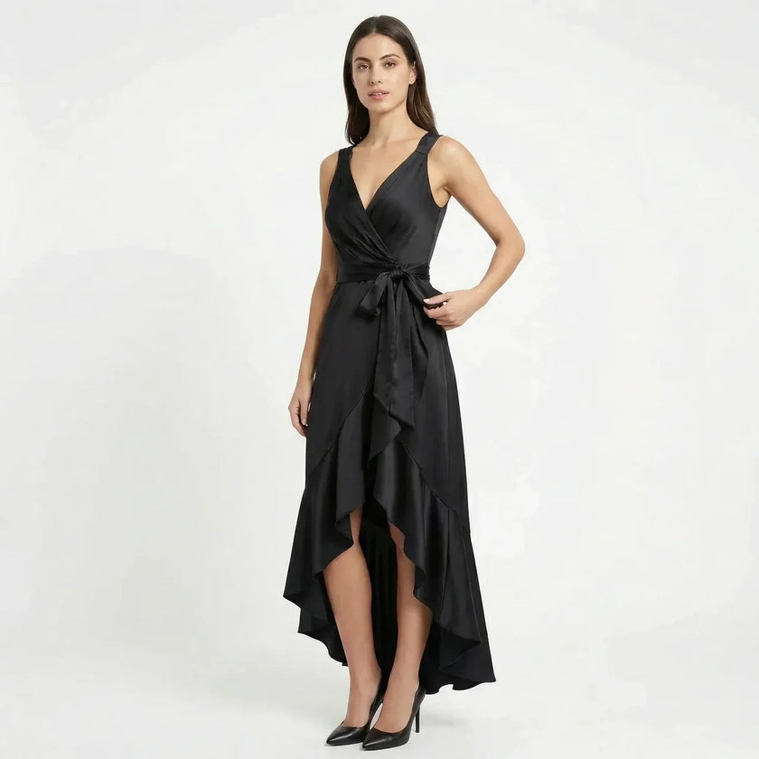 FJØRNA women's elegant sleeveless wrap midi dress displayed on a hanger, showcasing its flowing fabric and sophisticated design.