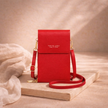 FJØRNA touchscreen crossbody phone bag for women with transparent front pocket for easy phone access.