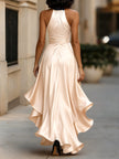 FJØRNA navy satin halter gown with ruffle details, elegant black tie dress perfect for formal occasions.