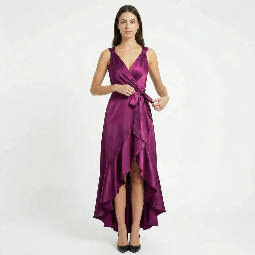 Elegant women's sleeveless wrap midi dress by FJØRNA, showcasing a flowing design and sophisticated style.