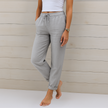 FJØRNA lightweight summer women's trousers with elastic waist, breathable fabric, and relaxed fit for casual wear.